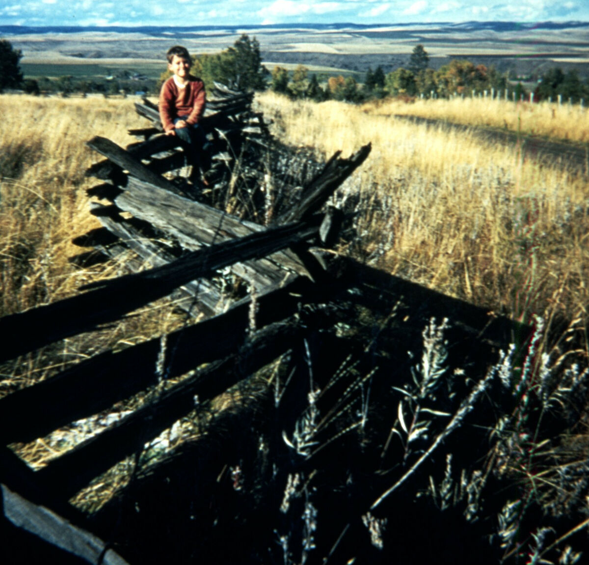 Todd Nash sits on a classic example of an early fence. Taken by Janie Tippett.